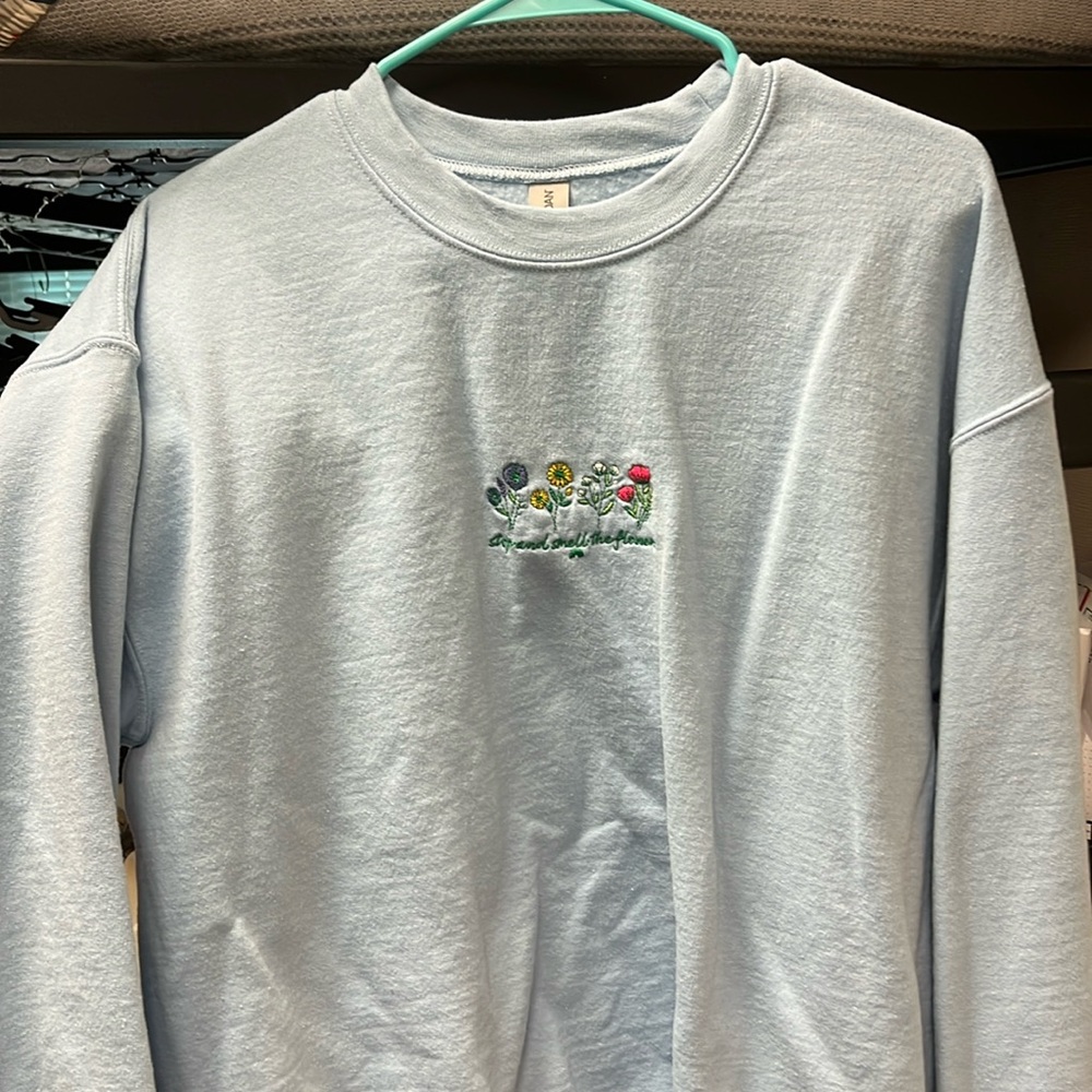 Light blue Nature Backs stop and smell the flowers sweatshirt